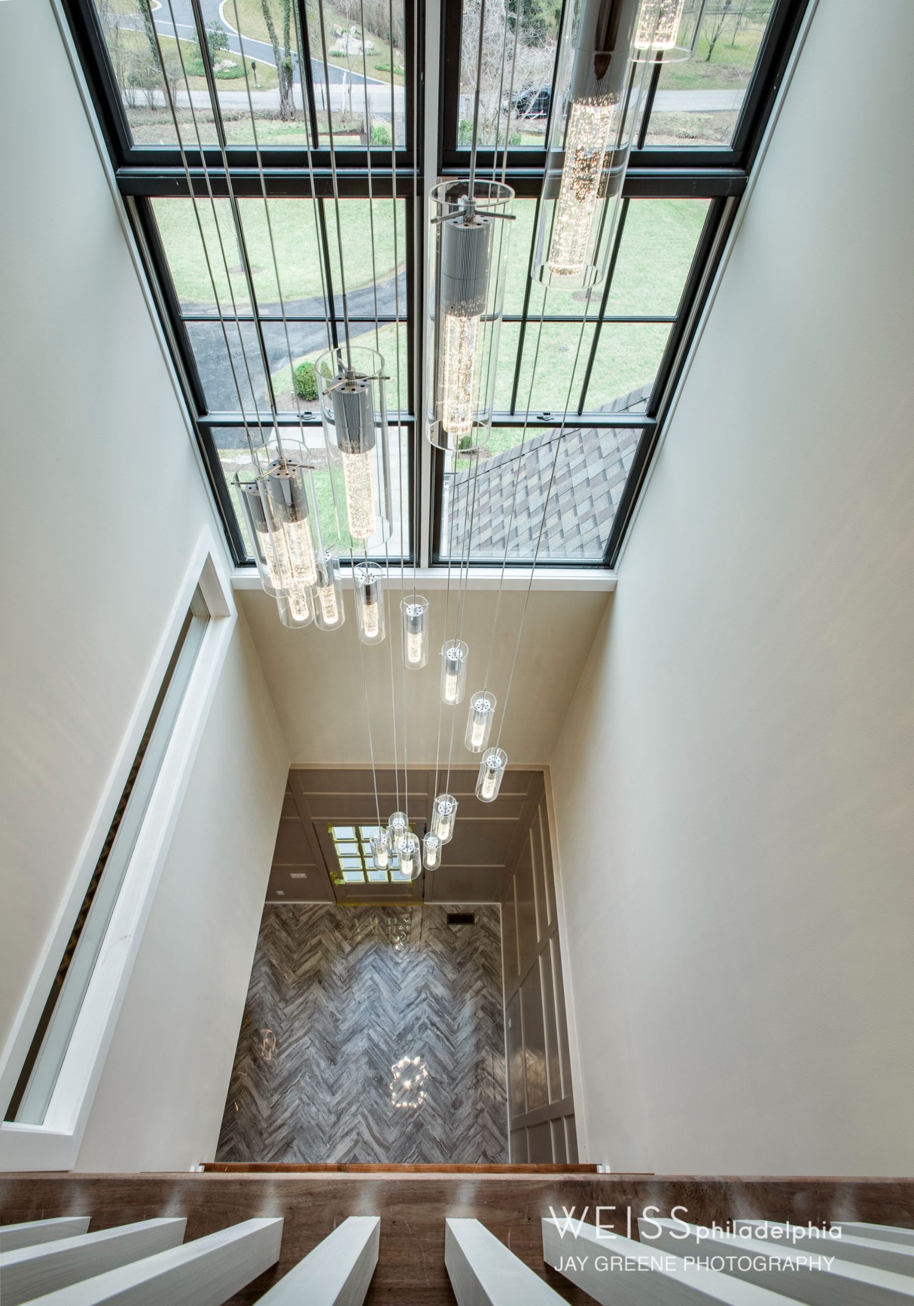 best custom homes wayne pa - design home studios - balcony - cascading chandelier - high ceilings