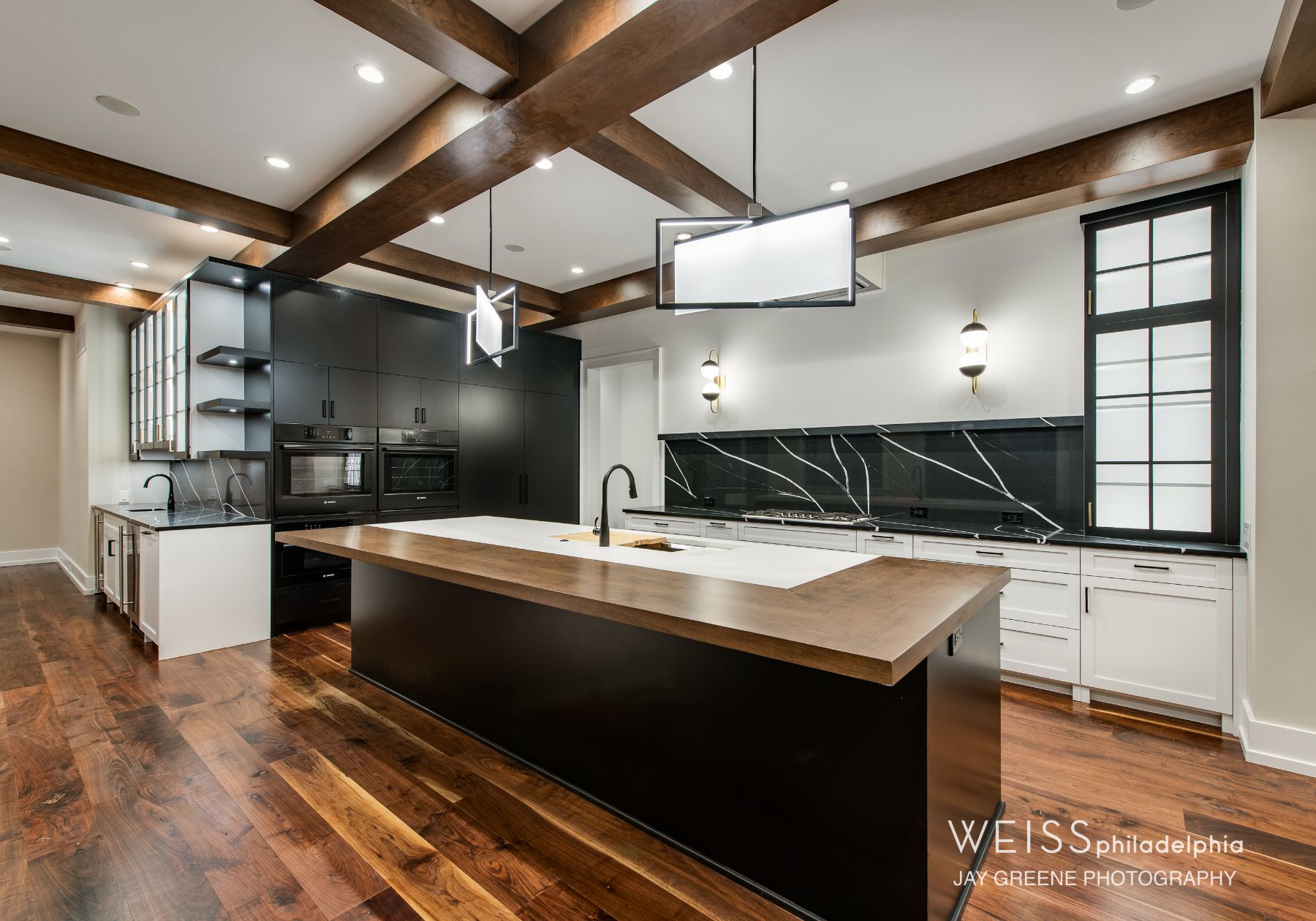 best custom homes wayne pa - design home studios - custom kitchen - wood countertops - exposed beams - black backsplash - white lights