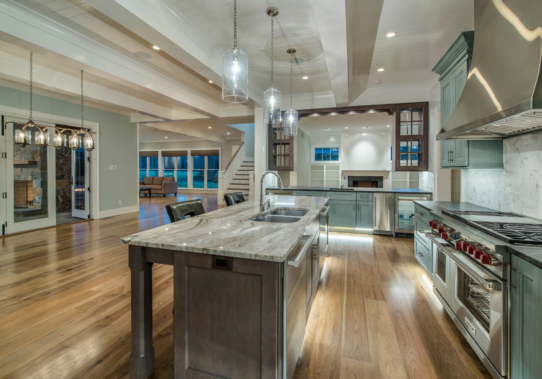 custom home builder Wayne pa - kitchen - teal cabinets - wood floors - grey countertops